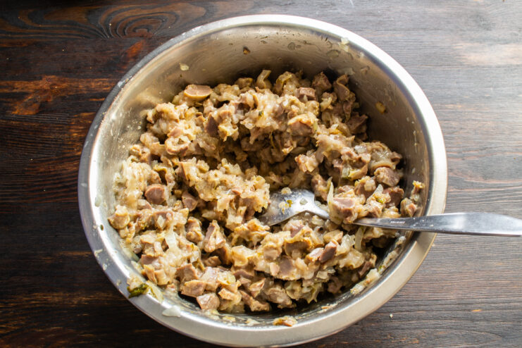 Mixing the sausage filling Well-mixed ground meat filling for sausages