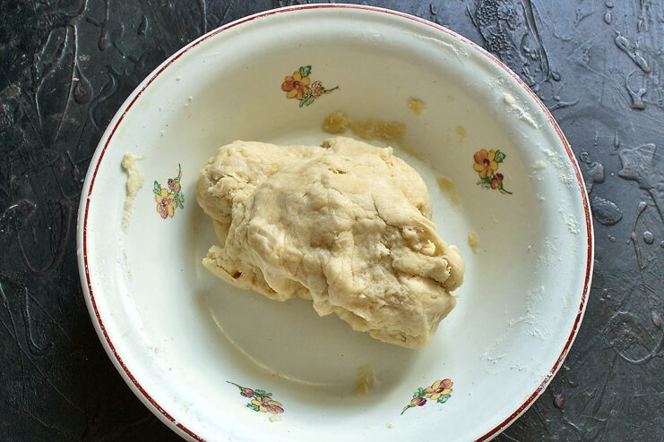 Kneaded galette dough. Smooth ball of kneaded vegan shortcrust dough in a mixing bowl