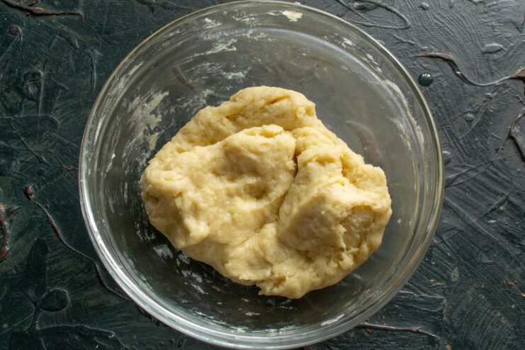 Resting The Dough A smooth ball of dough resting in a glass bowl