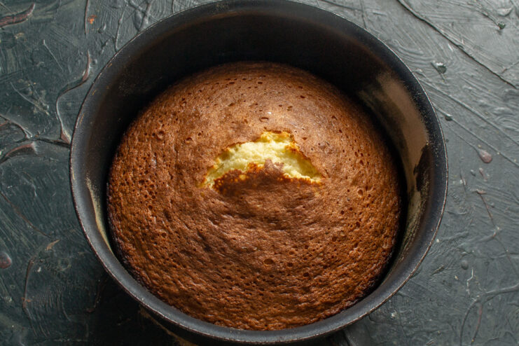 Freshly Baked Sponge Cake Golden baked nut sponge cake in a baking pan