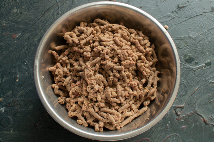 Ground Liver Base Ground chicken liver collected in a metal mixing bowl