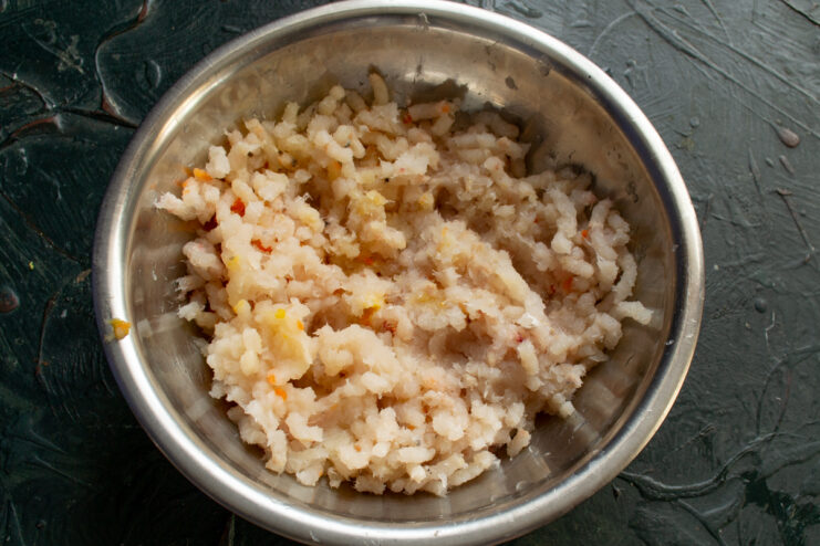Ground fish and onions in a bowl
