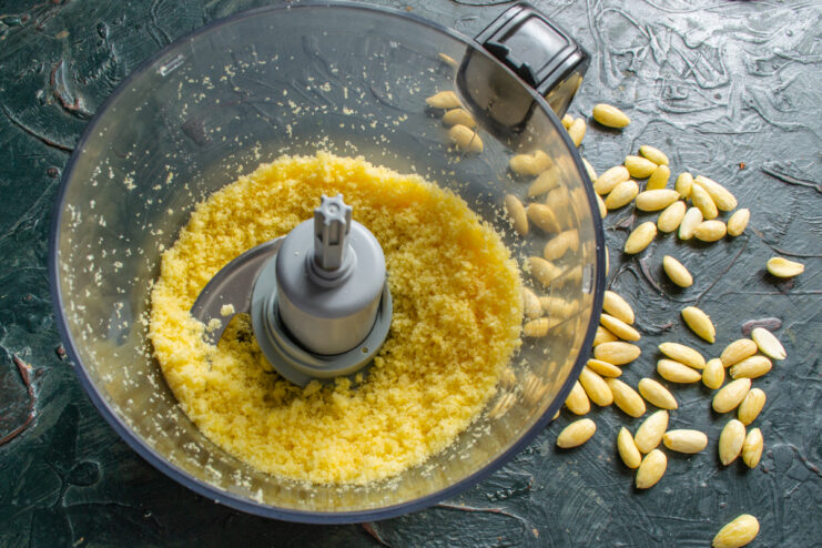 Finely crushed sweet corn puffs in a blender bowl