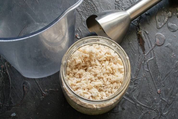 Preparing The Horseradish Base Ground fresh horseradish root stored in a glass jar