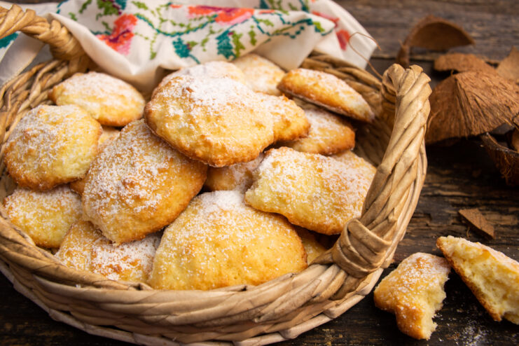 Fresh coconut cookies arranged in a woven basket