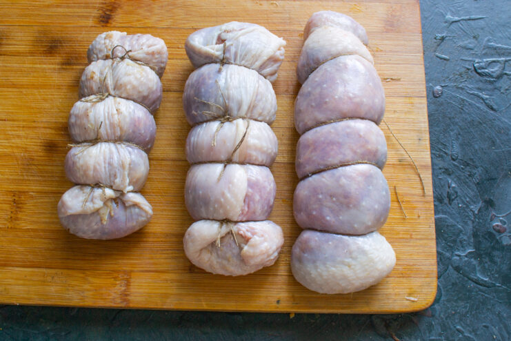 Tying The Sausages Sausages tied with kitchen twine at regular intervals