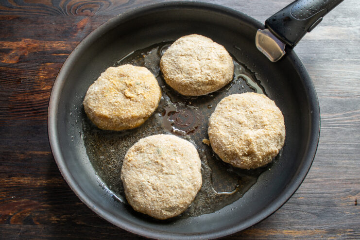 Frying the patties Chicken patties frying in a hot skillet with oil