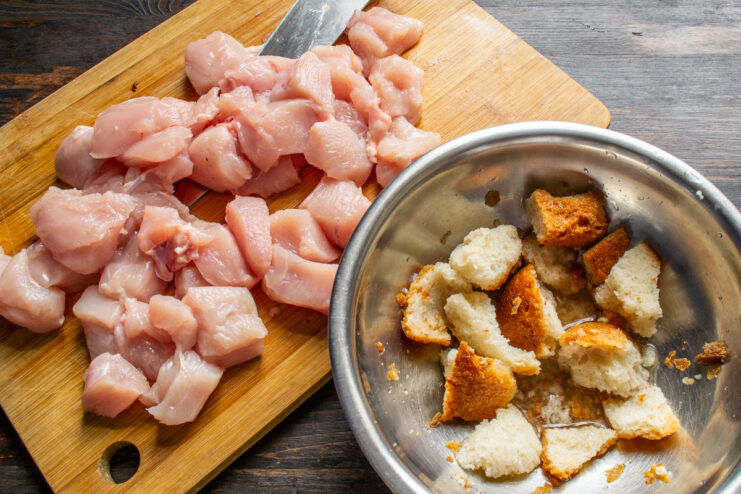 Soaking the bread Cubed chicken and a bowl of soaking white bread pieces