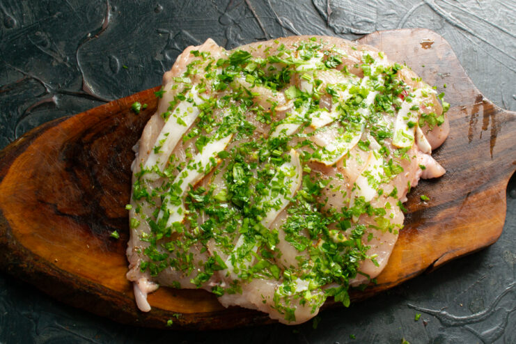 Chicken fillet covered with freshly chopped parsley