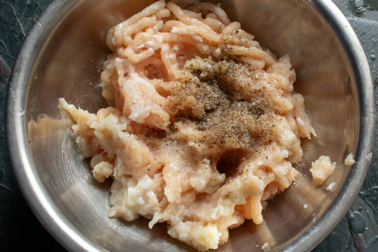 Ground chicken mixture seasoned with salt and black pepper