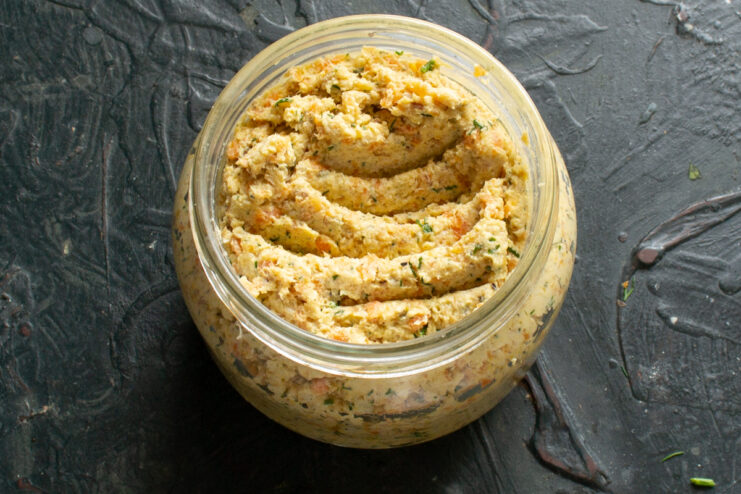 Storing homemade pate Top-down view of homemade chicken pate in a glass jar covered with olive oil