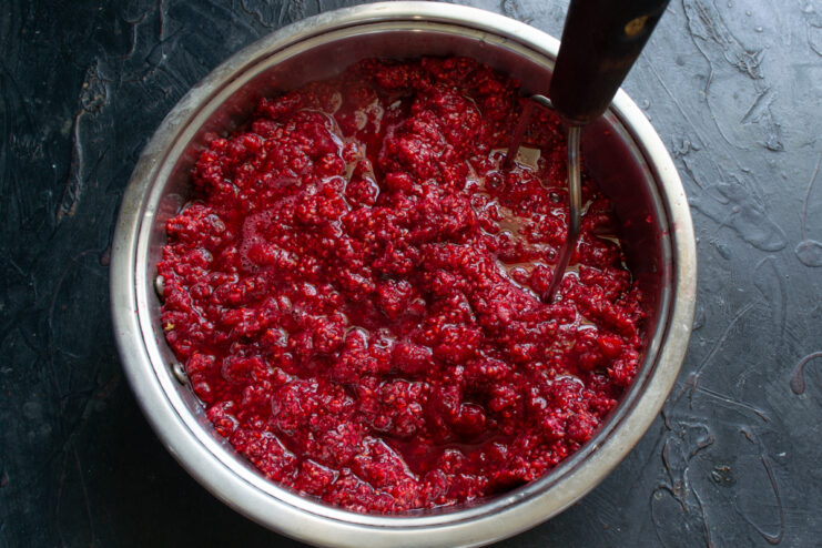 Raspberry puree for syrup Raspberry puree in a pot after mashing