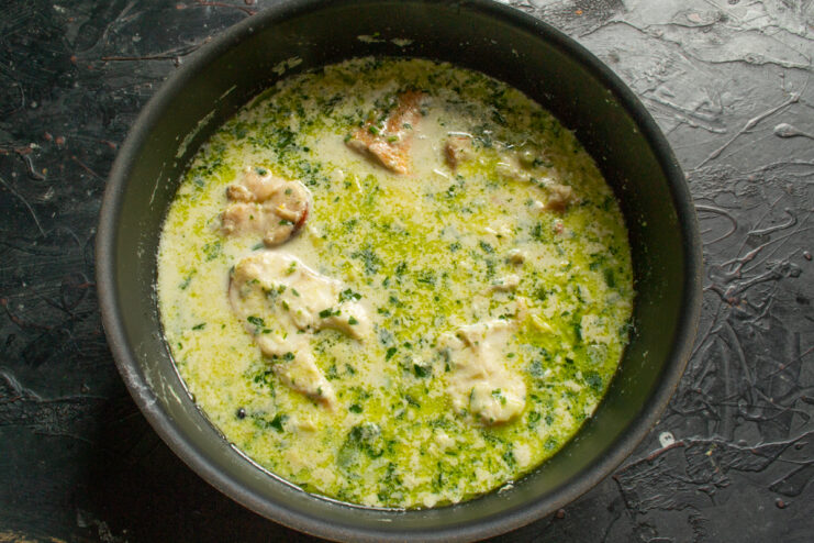 Simmering the Fish Chunks of ocean perch simmering gently in a creamy broth