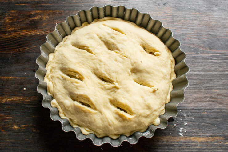 Preparing Pie for Baking Slits cut into the top layer of pie dough to release steam