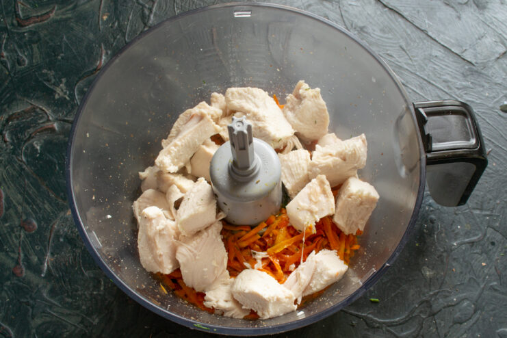 Adding chicken breast Diced boiled chicken breast added to the food processor with other ingredients