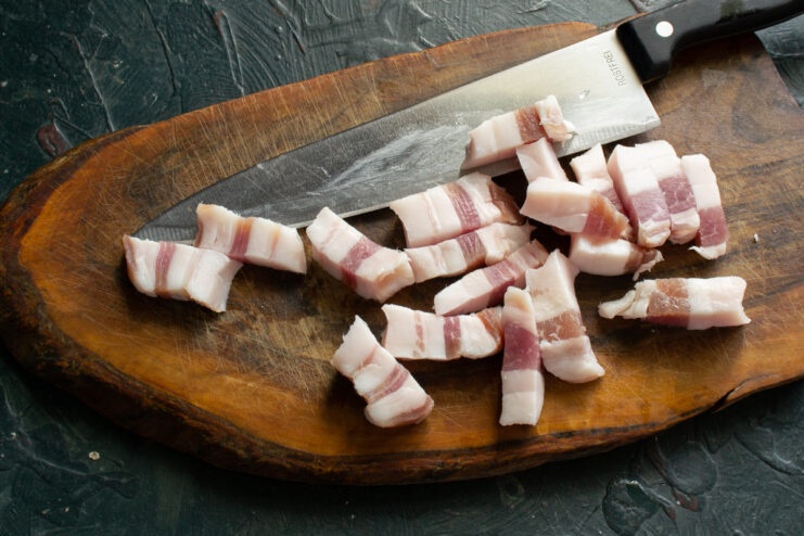 Dicing The Pork Fat Finely diced pork fat on a cutting board