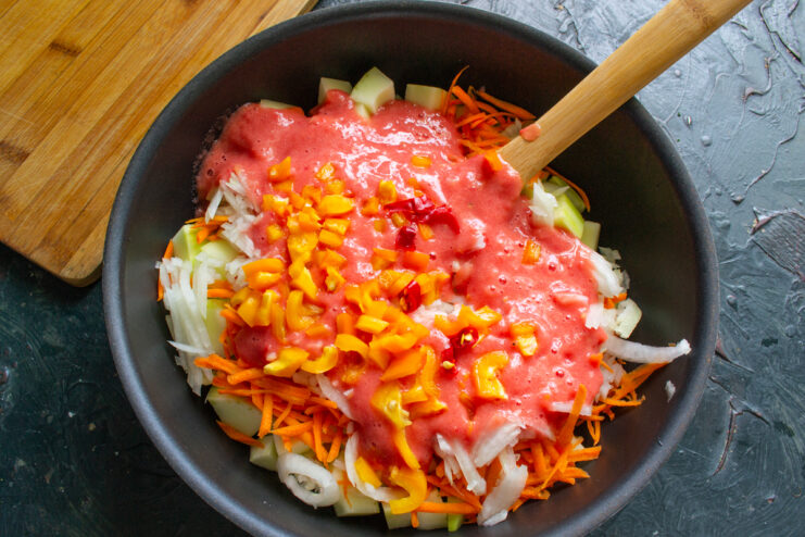 Diced bell pepper and chili in a sauté pan