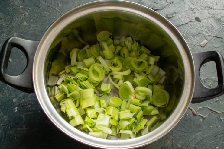 Preparing the leek Sliced leek rings placed inside a cooking pot