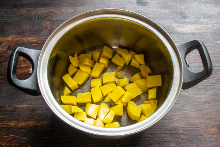 Prepping potatoes for the borscht Diced potatoes inside a metal cooking pot