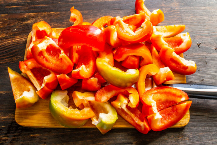 Slicing the peppers into wedges Slicing thick wedges of fresh Gogoshari peppers