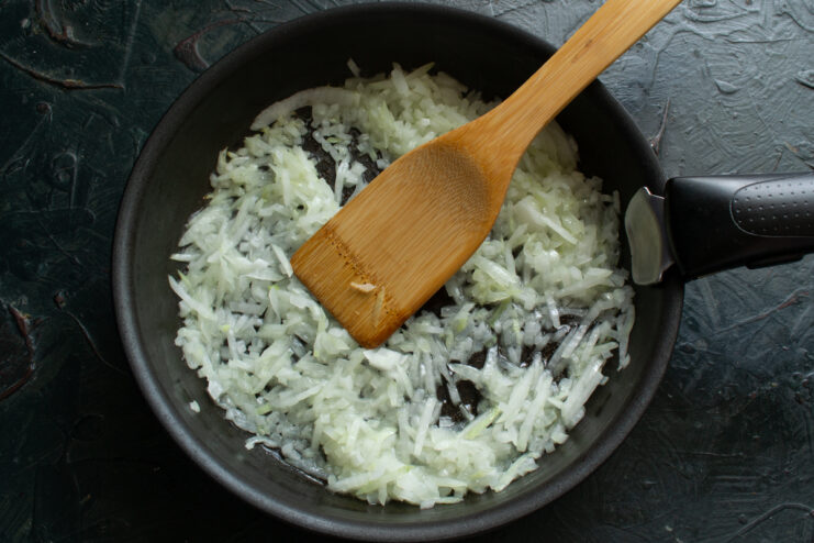 Sautéing the onions Sautéing finely diced onions in a skillet