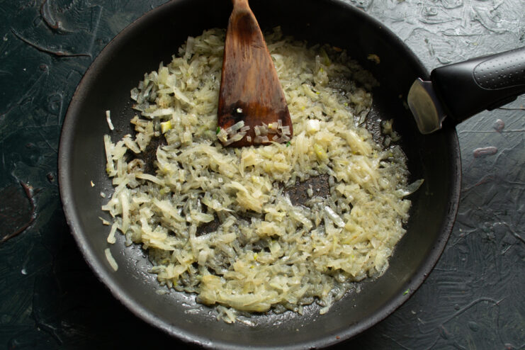 Preparing the Onion Sautéing chopped onions in a frying pan