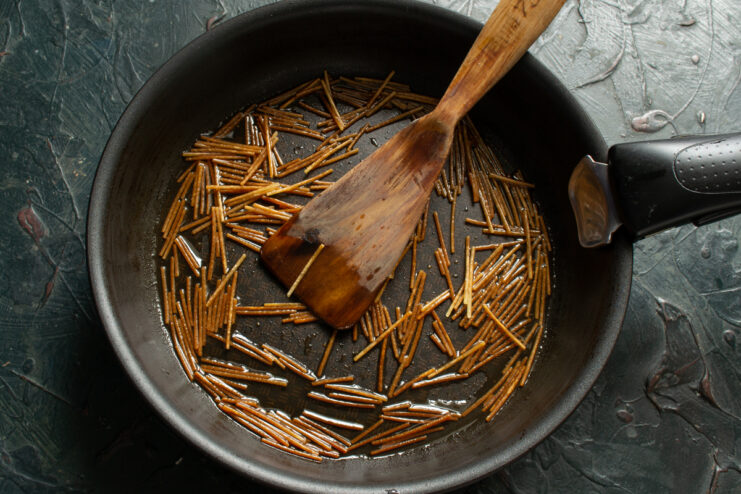 Frying Vermicelli Frying vermicelli in a skillet
