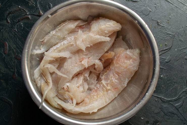 Cleaned fresh fish fillets in a bowl