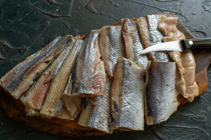 Prepping the cured fillets Cured herring fillets with skin and bones removed, chopped into large pieces