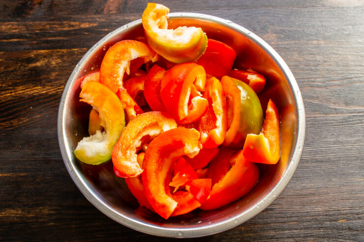 Weighing the prepared peppers Cleaned and sliced Gogoshari peppers in a bowl ready to be weighed