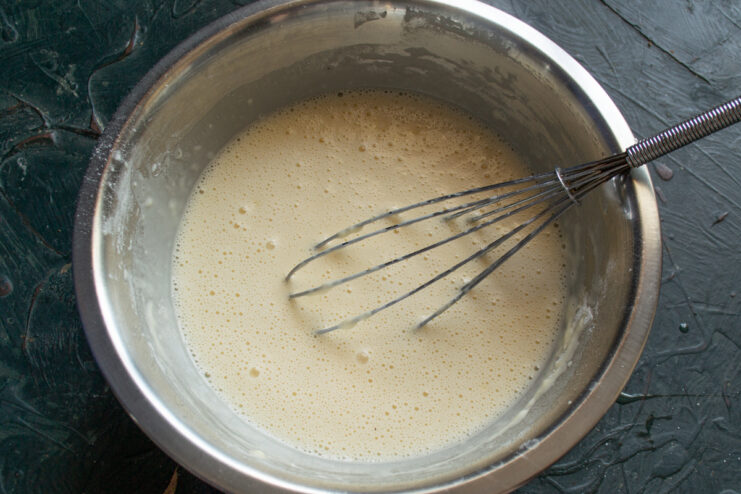 Smooth, lump-free crepe batter resting in a bowl