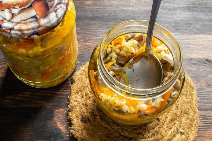 Finished stew in a jar Opened jar of finished homemade gizzard stew with a spoon inside