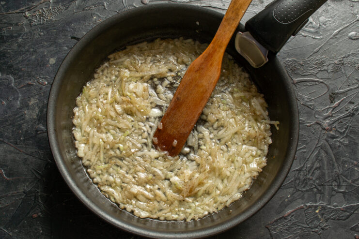 Sautéing the onion Chopped onion sautéing in a skillet