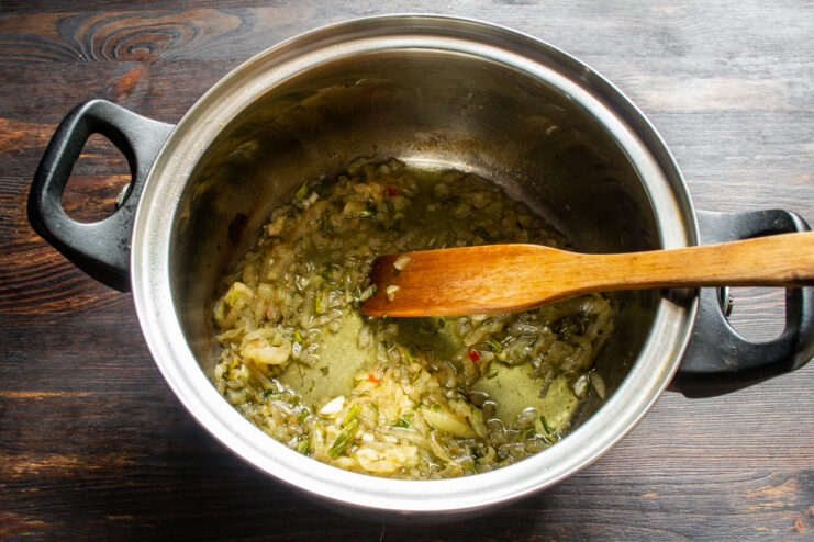 Softened translucent onions simmering in a pot