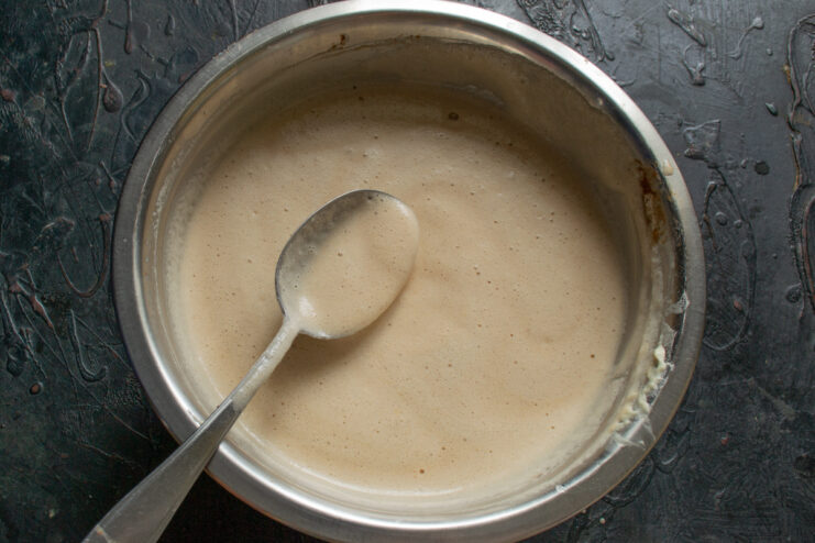 Folding egg whites into the chocolate batter Gently folding whipped egg whites into the chocolate batter