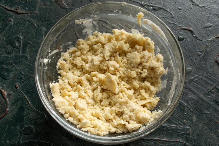 Making The Crumb Mixture Rubbing flour and fat together by hand to form coarse crumbs