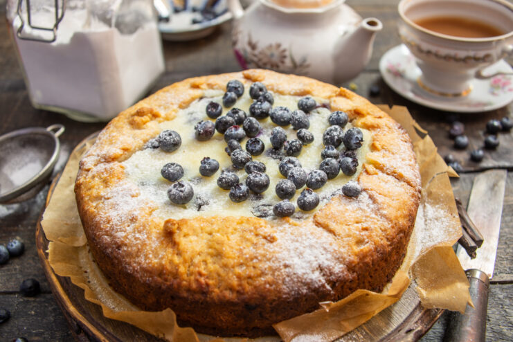 Baked homemade ricotta and blueberry pie on a table