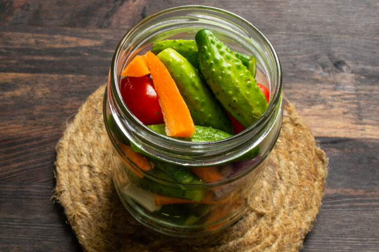 Tightly packed vegetables in a glass pickling jar