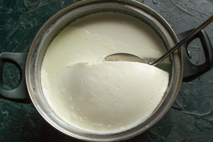 Formation of the milk curd Firm milk curd formed in a pot during the cheese-making process