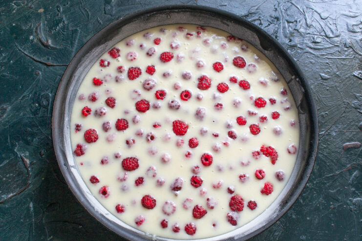 Cake Ready For Baking Fully assembled layered raspberry cake in a pan before baking