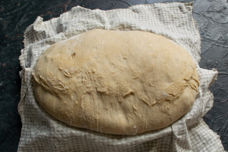 Cold proofing the dough Risen dough resting inside a proofing basket after a cold retard