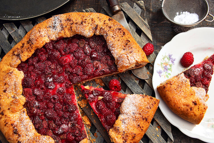 Crispy vegan galette with juicy berry filling on a rustic surface