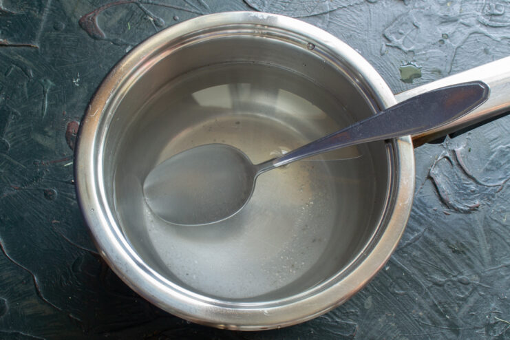 Boiling brine with sugar and salt in a cooking pot