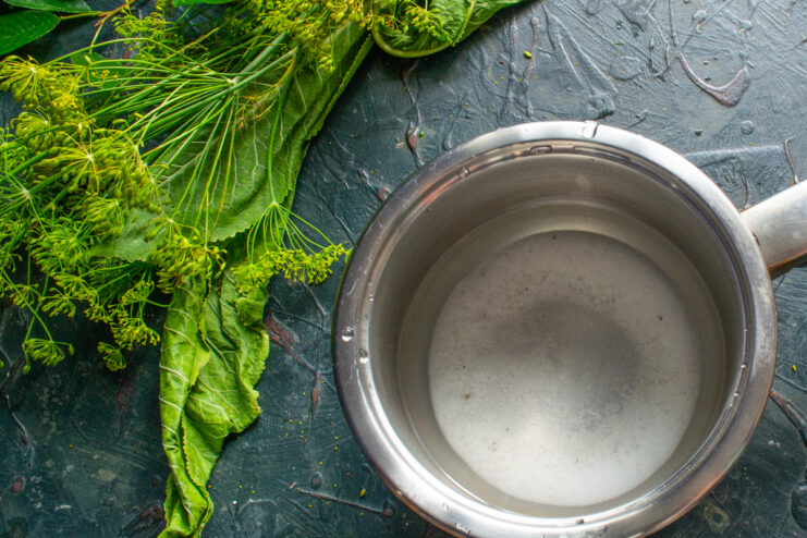Dissolving salt in water Whisking a saltwater brine solution in a metal pot