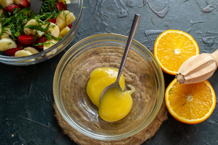 Mixing The Citrus Dressing Freshly squeezed orange juice mixed with honey