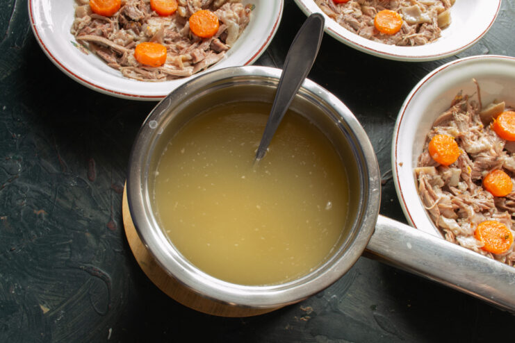 Preparing the Liquid Strained hot broth in a saucepan.