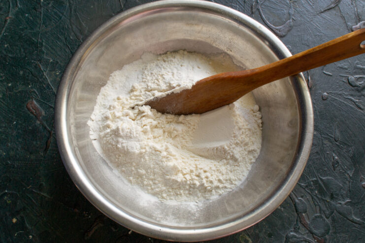 Preparing the dry ingredients Sifting all-purpose flour and baking powder into a bowl