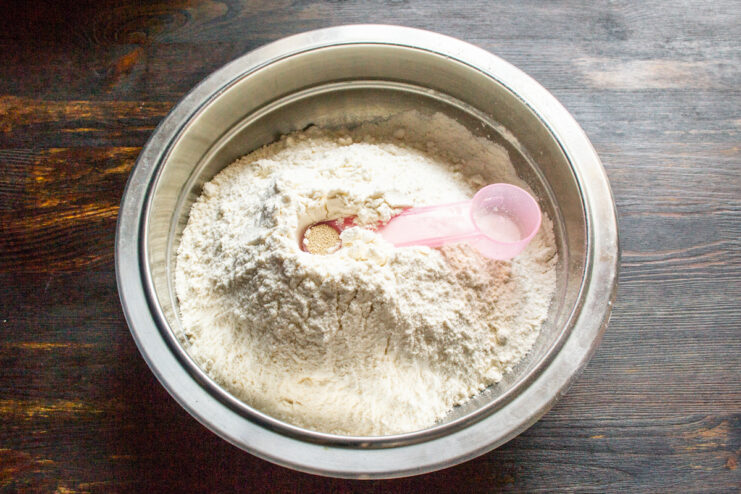Dry Dough Ingredients Sifted flour mixed with dry yeast inside a deep bowl