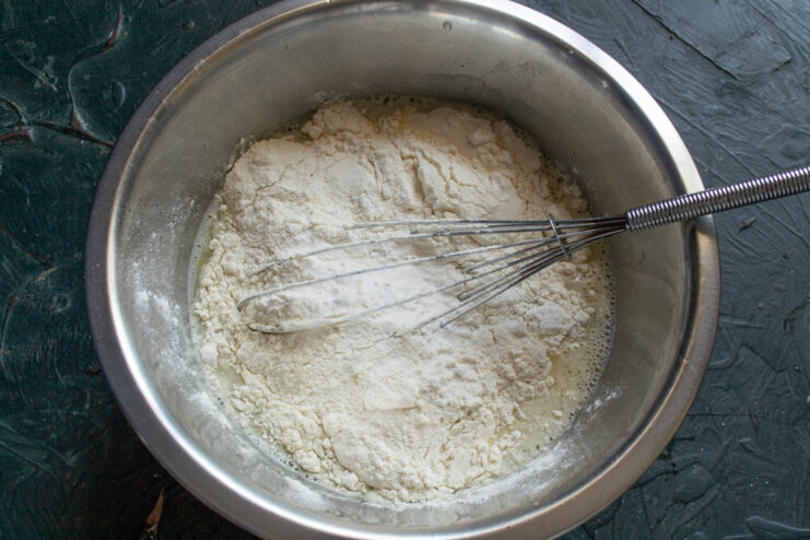 Flour and baking soda added to the liquid mixture