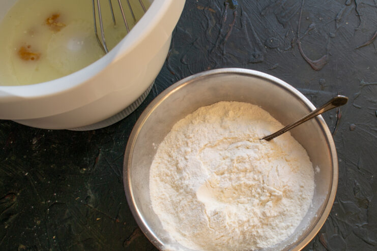 Wheat flour mixed with baking powder in a separate bowl
